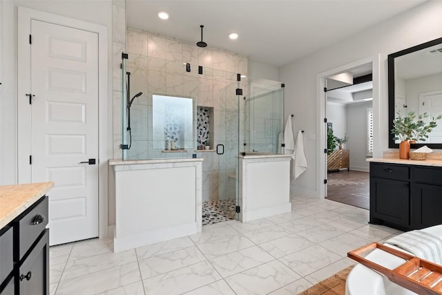 bathroom with vanity and an enclosed shower