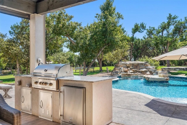 view of swimming pool with area for grilling