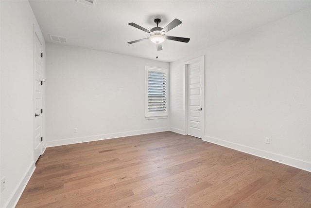 spare room featuring ceiling fan and light hardwood / wood-style flooring