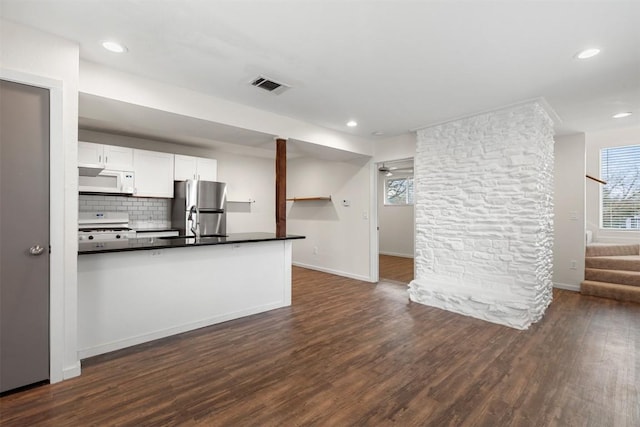 unfurnished living room featuring dark hardwood / wood-style flooring and sink