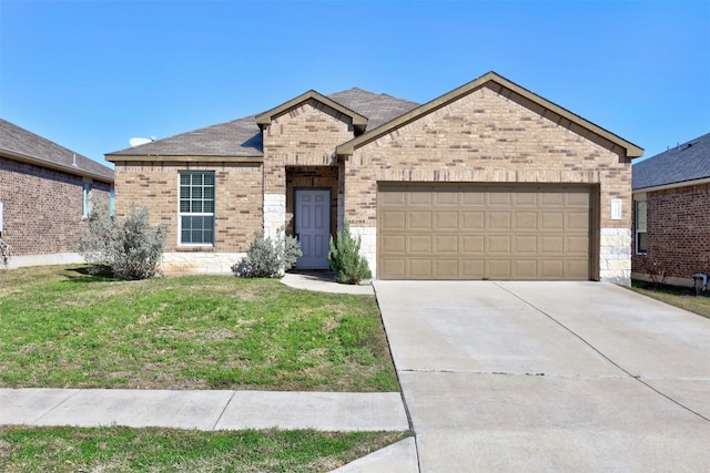 view of front of home featuring a front yard and a garage