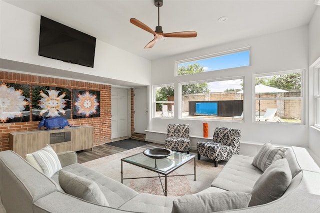 living room with hardwood / wood-style floors, ceiling fan, and a healthy amount of sunlight