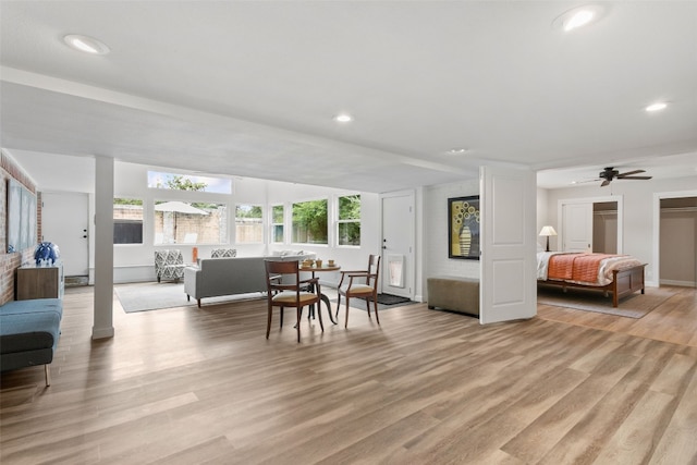 dining area with light hardwood / wood-style floors and ceiling fan