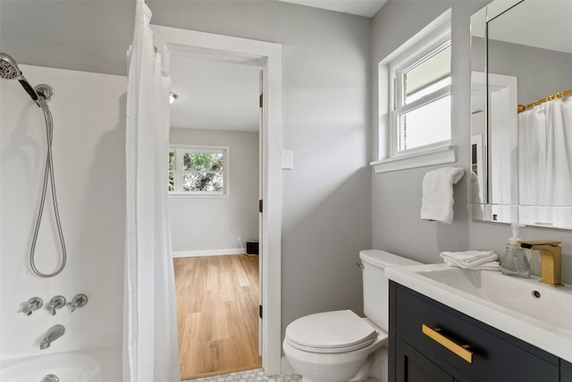 full bathroom with vanity, toilet, and shower / bath combo with shower curtain