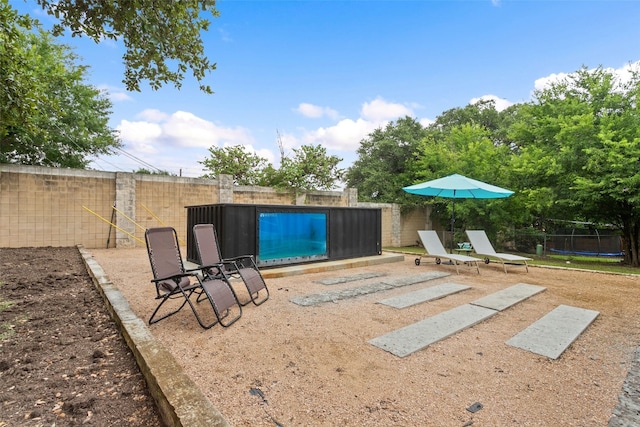 view of yard with a trampoline