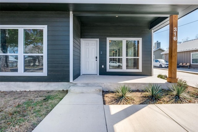 doorway to property featuring a porch