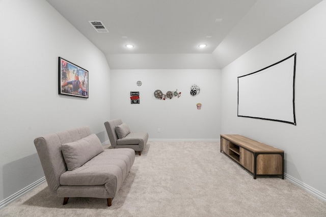 carpeted cinema with vaulted ceiling