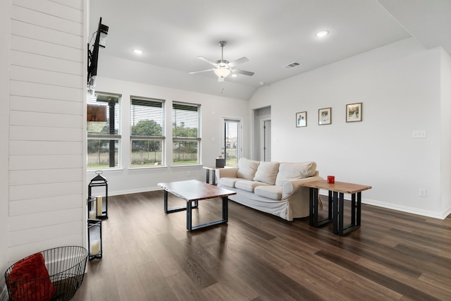 living room with ceiling fan, vaulted ceiling, and dark hardwood / wood-style floors