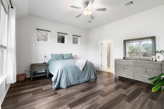 bedroom with ceiling fan and dark hardwood / wood-style floors