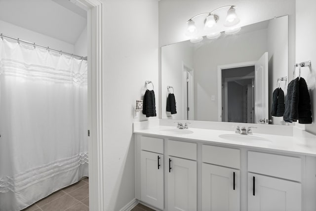 bathroom featuring tile patterned flooring and vanity