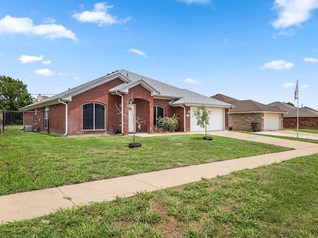 single story home with a garage and a front yard