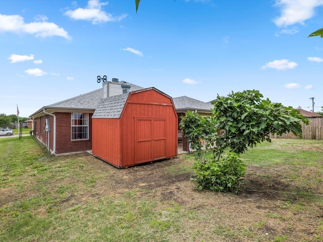 view of outbuilding featuring a lawn