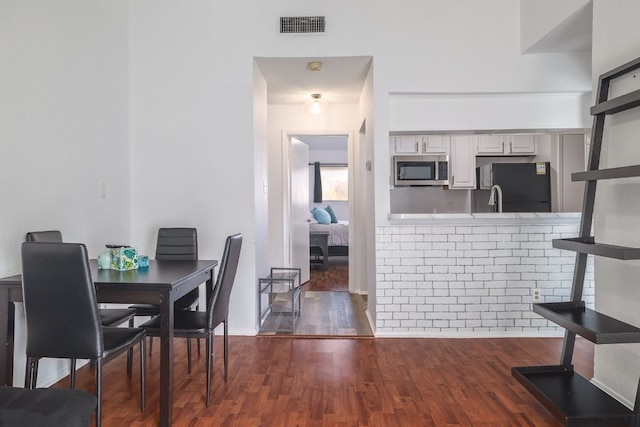 dining room featuring dark wood-type flooring