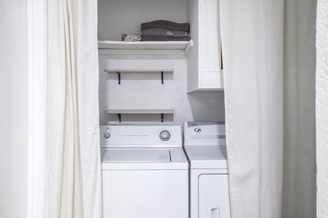 laundry area with washing machine and dryer