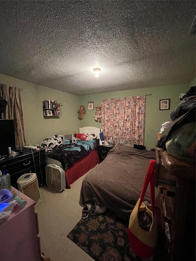 bedroom featuring a textured ceiling