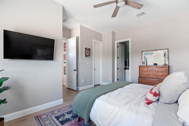 bedroom with light hardwood / wood-style floors and ceiling fan