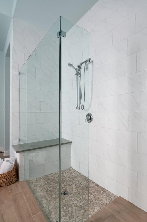 bathroom with a tile shower