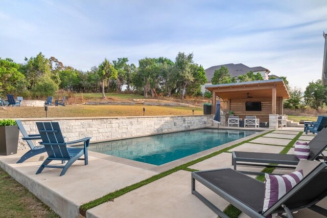 view of swimming pool featuring a patio