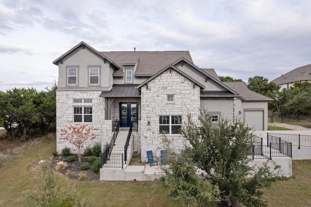 view of front of property with driveway, a garage, a shingled roof, metal roof, and a standing seam roof