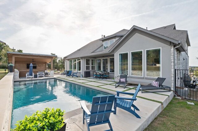 view of swimming pool with a patio area