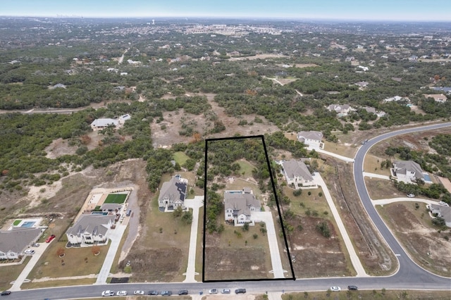 birds eye view of property with a residential view