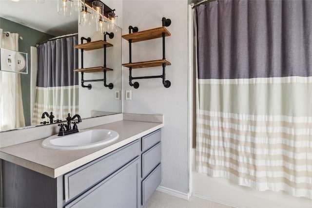 bathroom featuring vanity and shower / tub combo with curtain