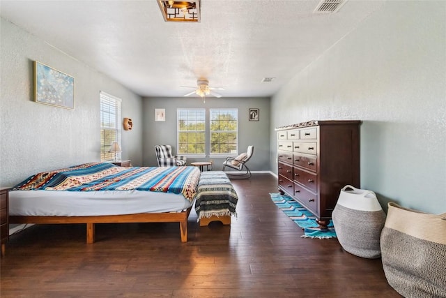 bedroom featuring ceiling fan and dark hardwood / wood-style flooring