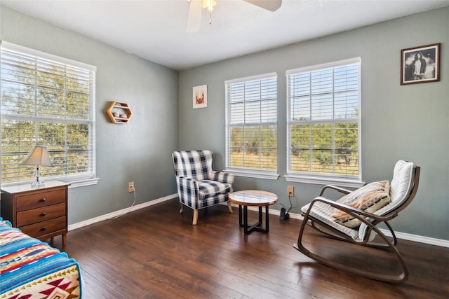 sitting room featuring dark hardwood / wood-style flooring and ceiling fan