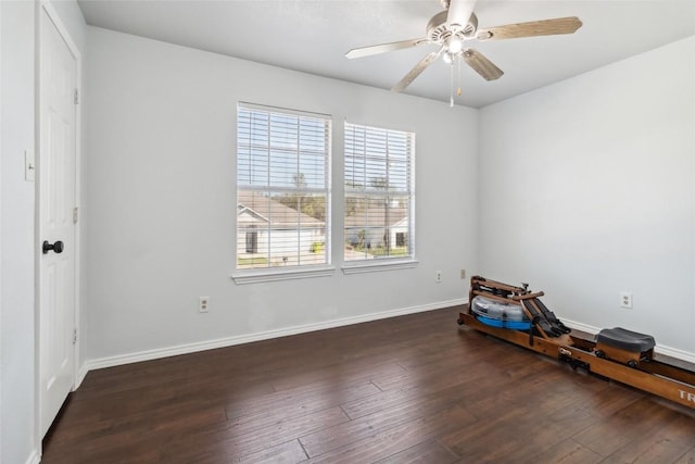 spare room featuring dark hardwood / wood-style floors and ceiling fan