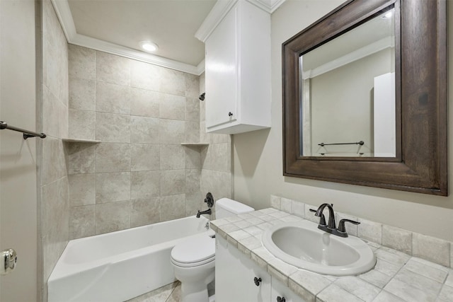 full bathroom featuring tiled shower / bath combo, toilet, ornamental molding, and vanity