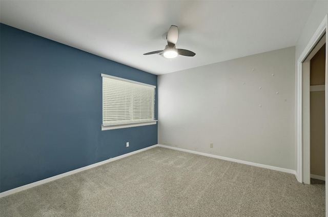 unfurnished bedroom featuring ceiling fan, light carpet, and a closet