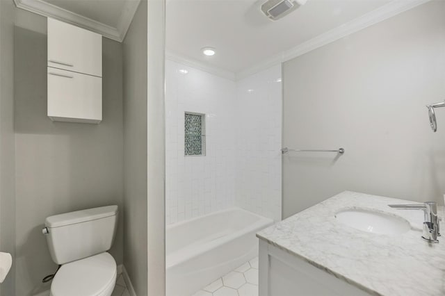 full bathroom with vanity, tile patterned floors, tiled shower / bath combo, toilet, and ornamental molding