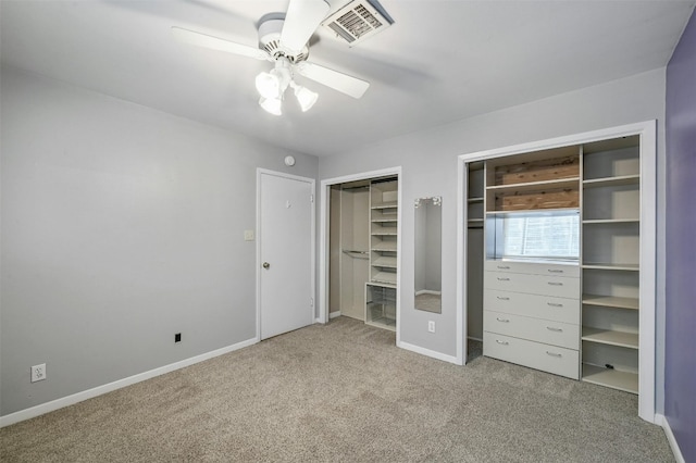 unfurnished bedroom featuring ceiling fan and carpet floors