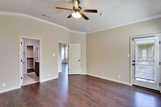 empty room featuring ceiling fan, dark wood-type flooring, crown molding, and vaulted ceiling