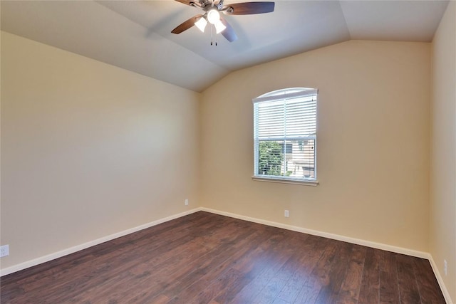 empty room with ceiling fan, dark wood-type flooring, and lofted ceiling