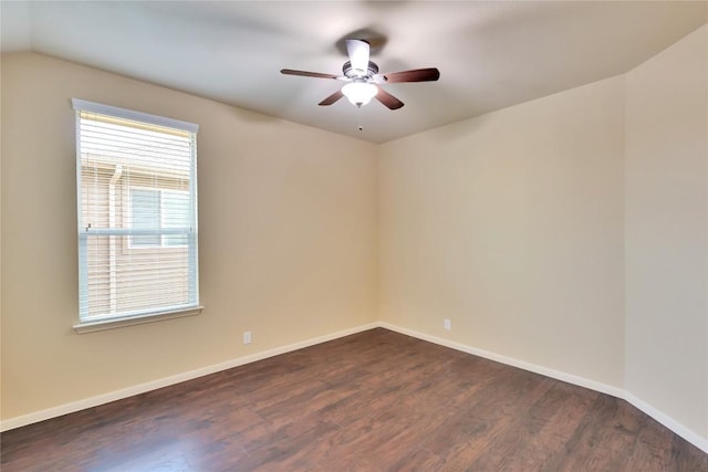 unfurnished room with ceiling fan and dark hardwood / wood-style flooring