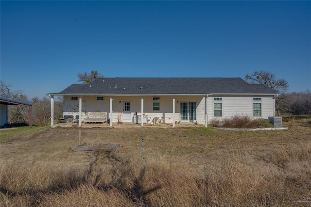 view of front of home featuring a front yard and cooling unit