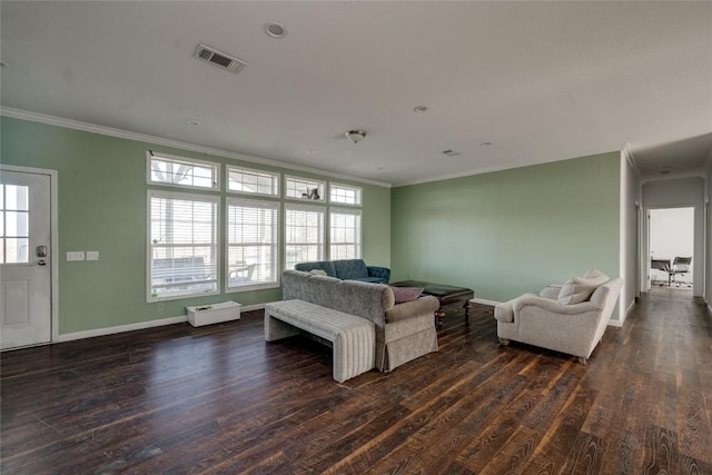 15701 Forest Glenn Cv, Del Valle, TX 78617 - living area with dark wood-style flooring, ornamental molding, and baseboards