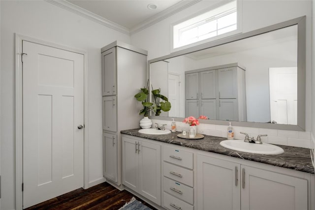 15701 Forest Glenn Cv, Del Valle, TX 78617 - full bath with double vanity, ornamental molding, and wood finished floors