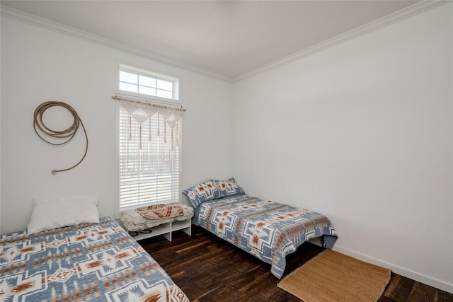 bedroom with ornamental molding and dark wood-type flooring