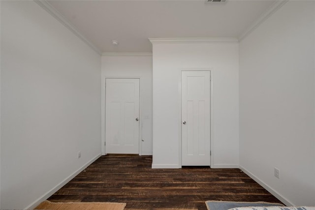15701 Forest Glenn Cv, Del Valle, TX 78617 - unfurnished bedroom featuring ornamental molding, wood finished floors, and baseboards
