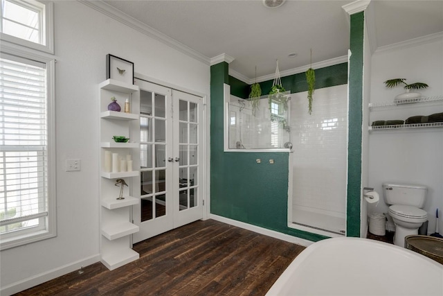 15701 Forest Glenn Cv, Del Valle, TX 78617 - full bathroom featuring wood finished floors, walk in shower, french doors, crown molding, and a freestanding tub