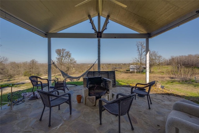 view of patio featuring an outdoor fire pit