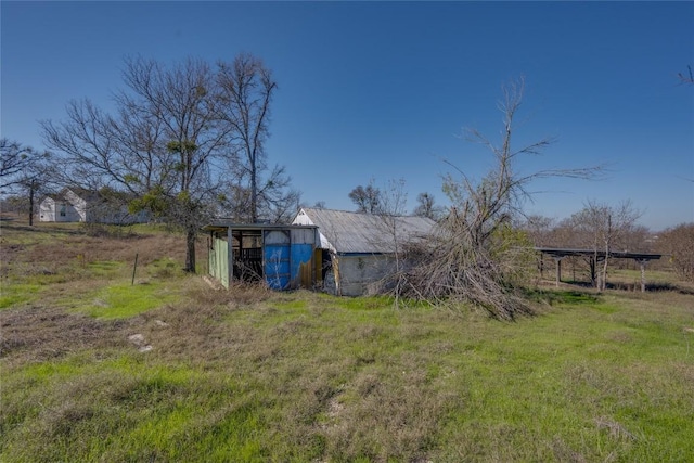 15701 Forest Glenn Cv, Del Valle, TX 78617 - view of yard featuring an outbuilding