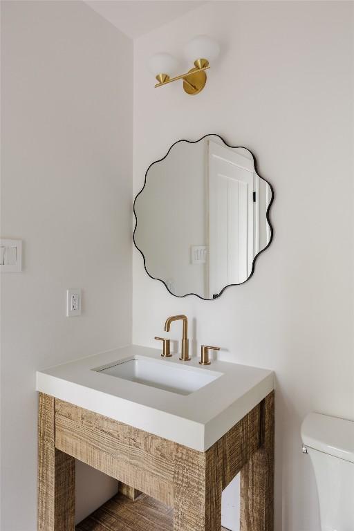 bathroom featuring toilet and sink