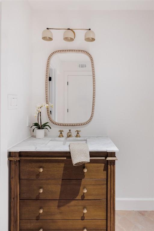 bathroom featuring tile patterned floors and vanity