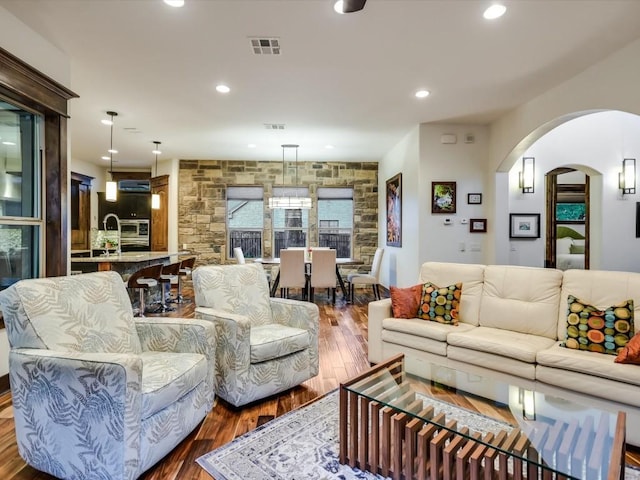 living room featuring dark wood-type flooring