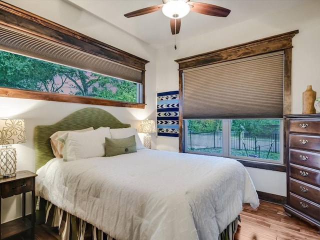 bedroom featuring ceiling fan and light hardwood / wood-style flooring