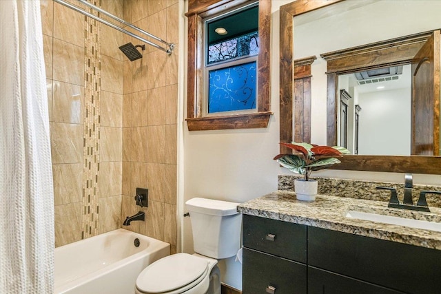 bathroom featuring vanity, shower / bath combination with curtain, and toilet