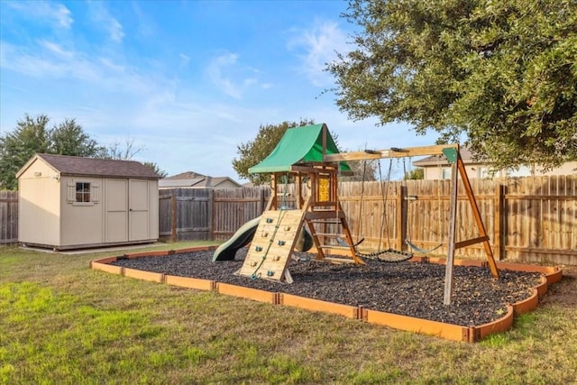 view of play area featuring a yard and a shed